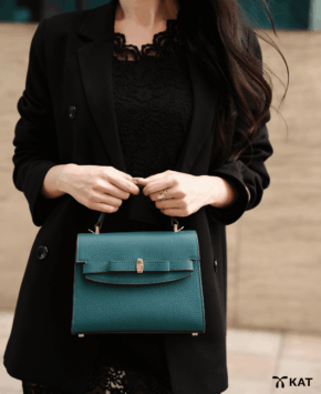 Túi cầm tay màu xanh teal Moss da thật